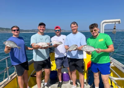 5 lads and their fish caught fishing in Lyme Bay